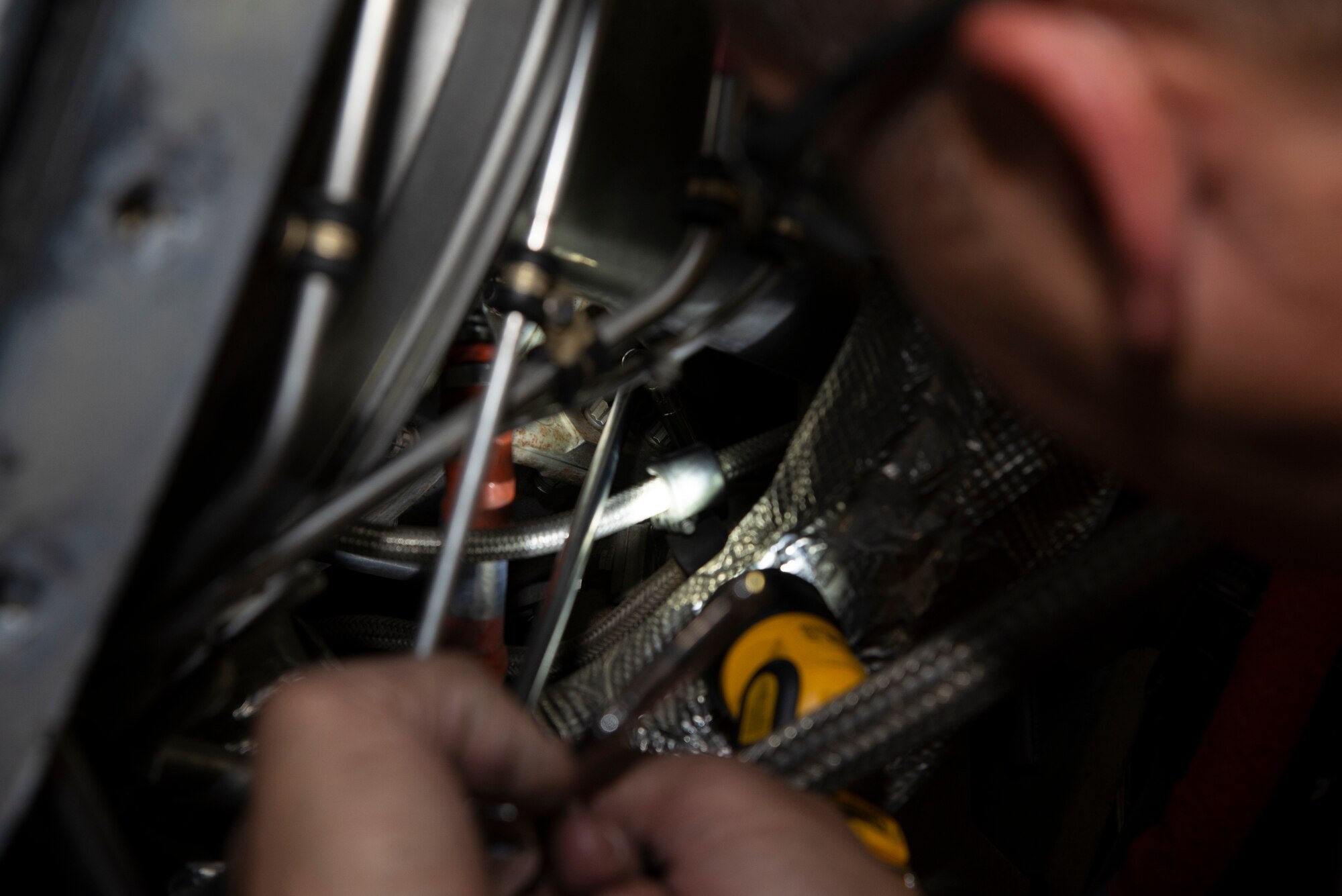 Staff Sgt. George Brennan, a 302nd Maintenance Squadron aerospace propulsion technician, examines a propulsion engine on a C-130 Hercules aircraft during an isochronal inspection at Peterson Air Force Base, Colorado, July 8, 2019.