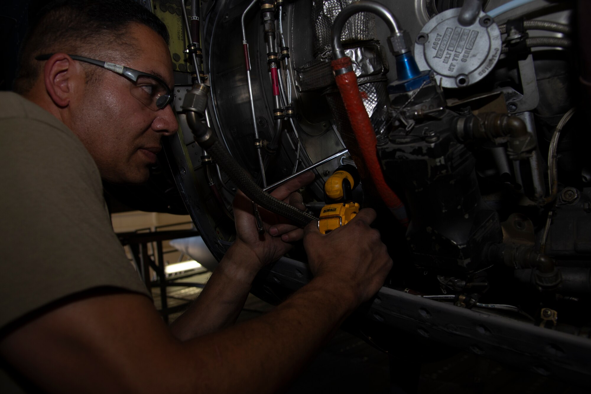 Staff Sgt. George Brennan, a 302nd Maintenance Squadron aerospace propulsion technician, replaces components on a C-130 Hercules aircraft during an isochronal inspection at Peterson Air Force Base, Colorado, July 8, 2019.
