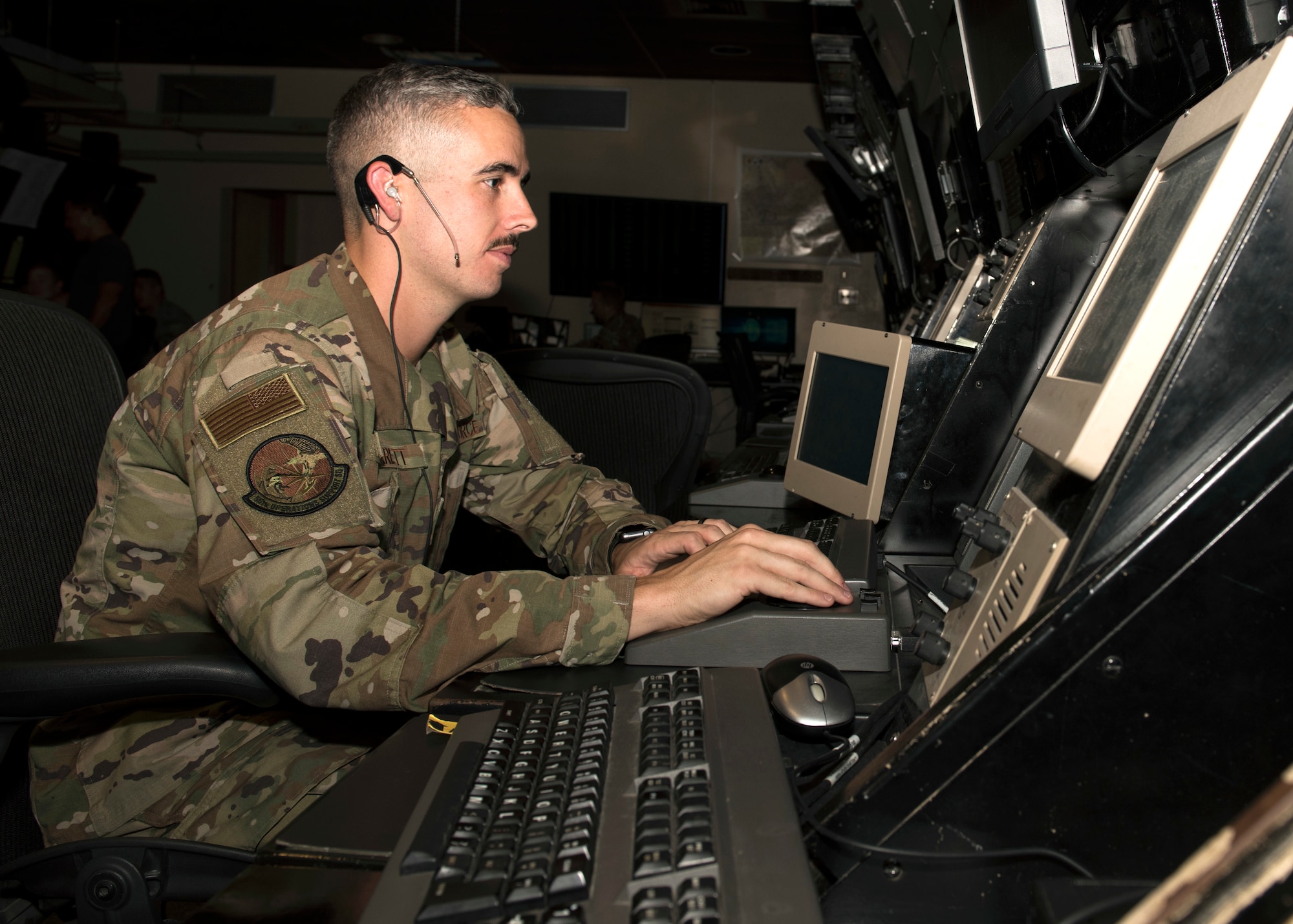 Staff Sgt. George Garrett, 56th Operation Support Squadron air traffic controller, plots the location of aircraft on a radar scope July 10, 2019, at Luke Air Force Base, Ariz.