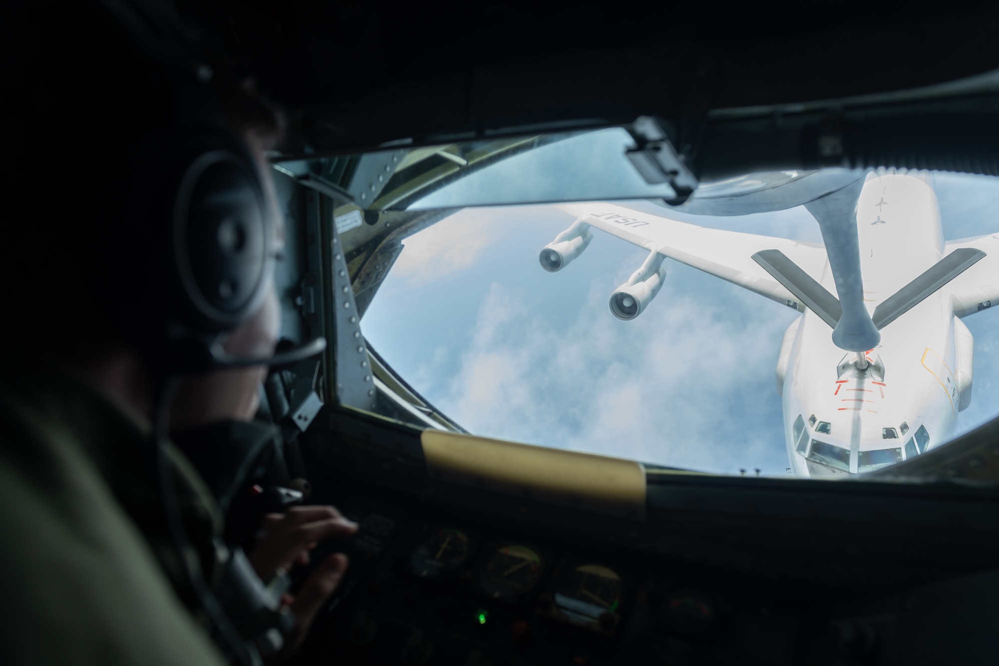 U.S. Air Force Staff Sgt. Michael Lawson, boom operator assigned to the 909th Air Refueling Squadron, refuels an E-3 Sentry, July 10, 2019, during a training exercise out of Kadena Air Base, Japan. The 909th ARS helps ensure a free and open Indo-Pacific by providing air refueling to U.S., allies and partners within the area of responsibility. (U.S. Air Force photo by Airman 1st Class Matthew Seefeldt)
