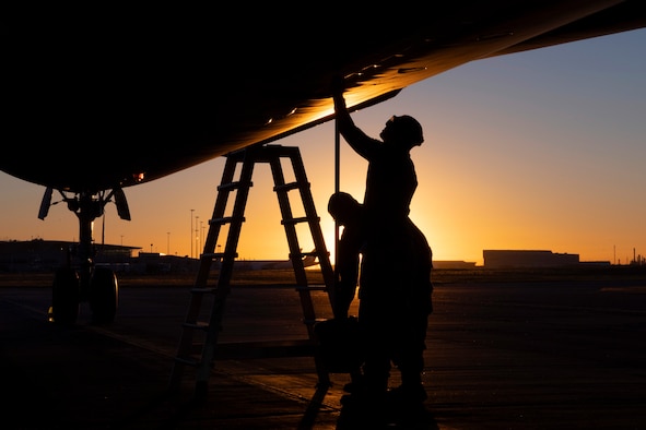 U.S. Air Force Staff Sgt. Ty Steinhausen, 605th Aircraft Maintenance Squadron, and USAF Tech. Sgt. Jerret Hupp, 305th AMXS, Joint Base McGuire-Dix-Lakehurst, New Jersey, perform routine pre-flight inspections of a USAF KC-10 prior to its departure July 16, 2019, at Brisbane International Airport, Australia. The Extender arrived July 12 to support major air operations for USAF, Royal Australian Air Force and U.S. Navy aircraft operating out of RAAF Base Amberley for Exercise Talisman Sabre 19, a biannual joint operation providing effective and intense training to ensure U.S. Forces are combat ready, capable, interoperable, and deployable on short notice.  (U.S. Air Force photo by Senior Airman Elora J. Martinez)