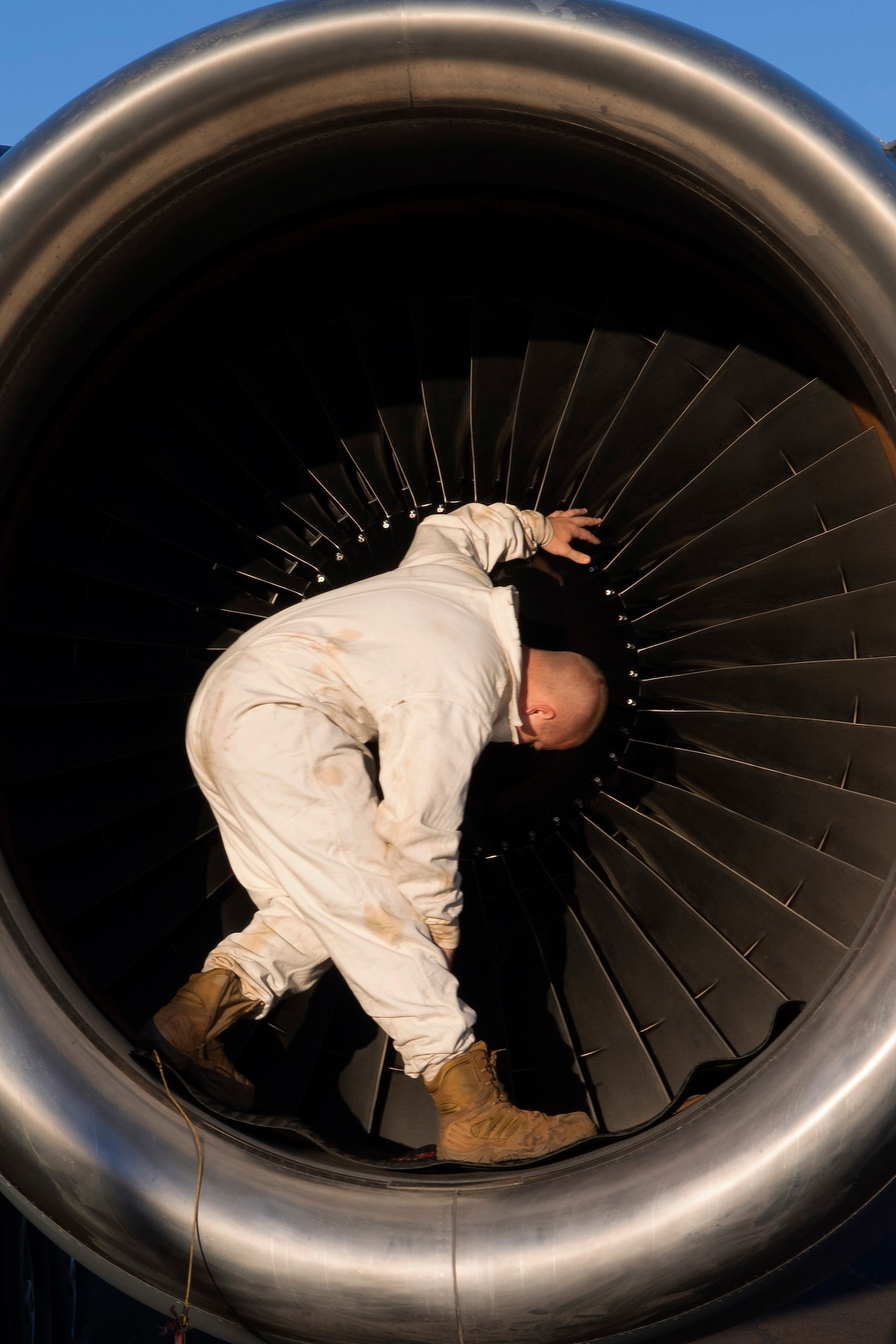 U.S. Air Force Staff Sgt.Ty Steinhausen, 605th Aircraft Maintenance Squadron, Joint Base McGuire-Dix-Lakehurst, New Jersey, performs routine maintenance checks on one of three turbine engines of a USAF KC-10 Extender July 16, 2019, at Brisbane International Airport, Australia. The Extender arrived July 12 to support major air operations for USAF, Royal Australian Air Force and U.S. Navy aircraft operating out of RAAF Base Amberley for Exercise Talisman Sabre 19, a biannual joint operation providing effective and intense training to ensure U.S. Forces are combat ready, capable, interoperable, and deployable on short notice.  (U.S. Air Force photo by Senior Airman Elora J. Martinez)