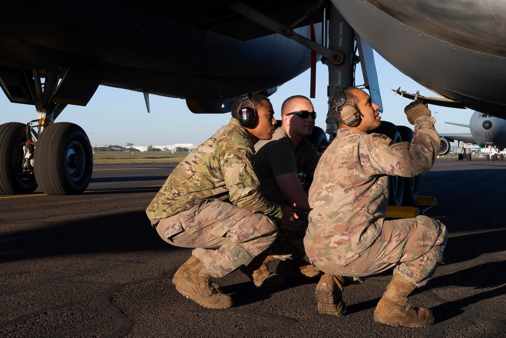 U.S. Airmen with the 605th Air Maintenance Squadron, Joint Base McGuire-Dix-Lakehurst, New Jersey, and the 60th AMXS, Travis Air Force Base, California, inspect a KC-10 Extender engine turbine during pre-flight checks July 16, 2019, at Brisbane International Airport, Australia. The Extender arrived July 12 to support major air operations for USAF, Royal Australian Air Force and U.S. Navy aircraft operating out of RAAF Base Amberley for Exercise Talisman Sabre 19, a biannual joint operation providing effective and intense training to ensure U.S. Forces are combat ready, capable, interoperable, and deployable on short notice.  (U.S. Air Force photo by Senior Airman Elora J. Martinez)