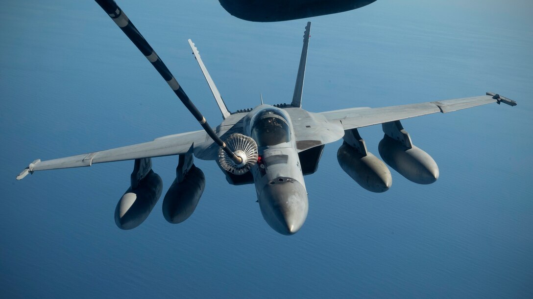 A Royal Australian Air Force F/A-18 Super Hornet is refueled by a U.S. Air Force KC-10 Extender July 17, over the Pacific Ocean near the coast of Brisbane, Australia, in support of Exercise Talisman Sabre 19. The Super Hornet was one of several aircraft used during TS19,  alongside other USAF and RAAF airborne warning and control system aircraft, refuelers, tankers and bombers. TS19 is a month of high end, realistic warfighting training designed to increase U.S. and Australian combat readiness and interoperability for a free and open Indo-Pacific. (U.S. Air Force photo by Senior Airman Elora J. Martinez)