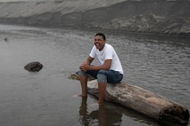 U.S. Air Force Airman Austin T. Clay, a 35th Maintenance Squadron weapons journeyman, sits on a log at Sabishiro Beach in Misawa, Japan, July 16, 2019. Clay hails from Tupelo, Mississippi; his favorite hobbies include singing, writing and exploring Japan. (U.S. Air Force photo by Airman 1st Class China M. Shock)