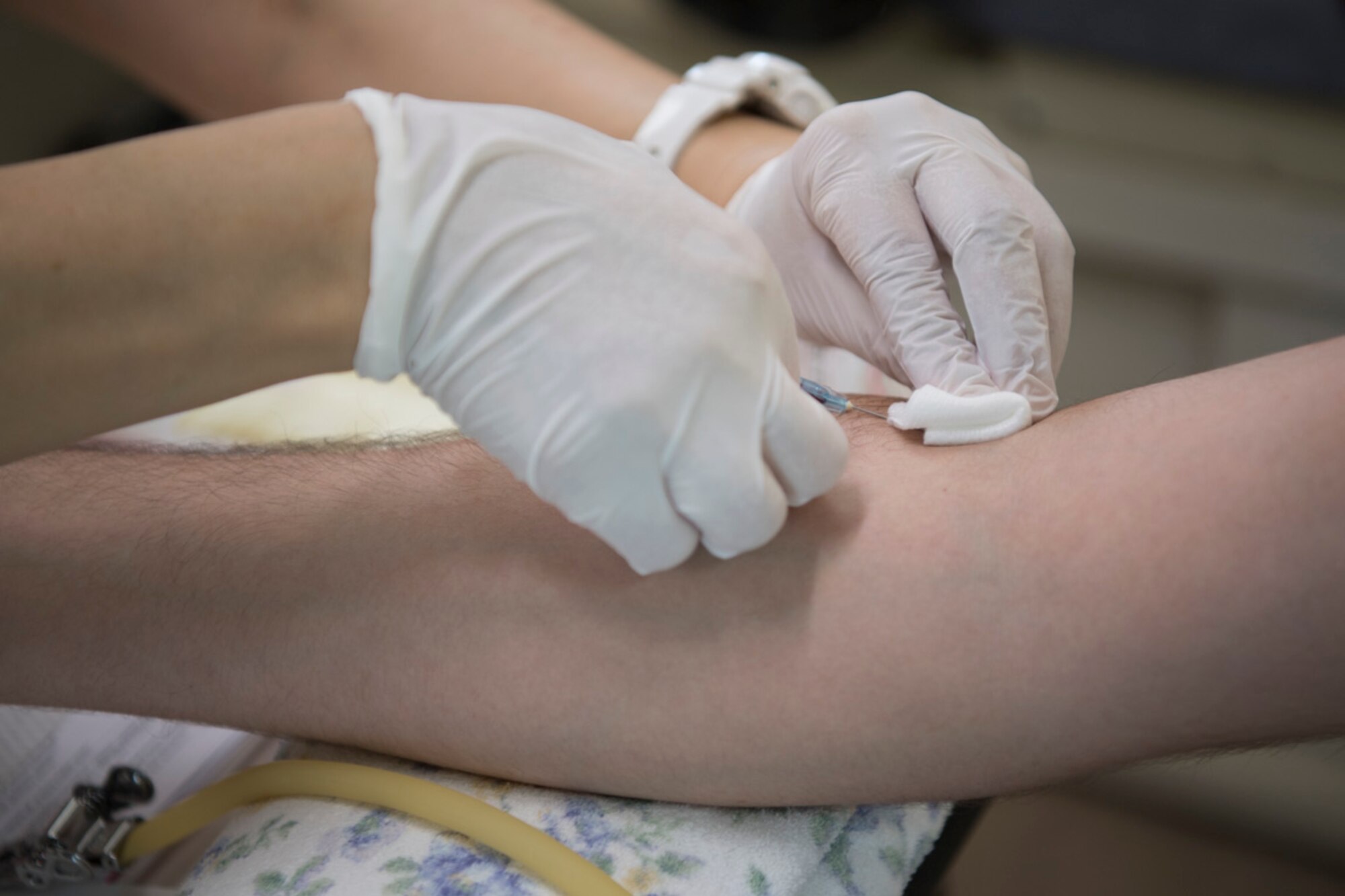 Airman 1st Class Sebastian York, 374th Communication Squadron cyber defense technician, donates blood at Yokota Air Base, Japan, July 18, 2019.