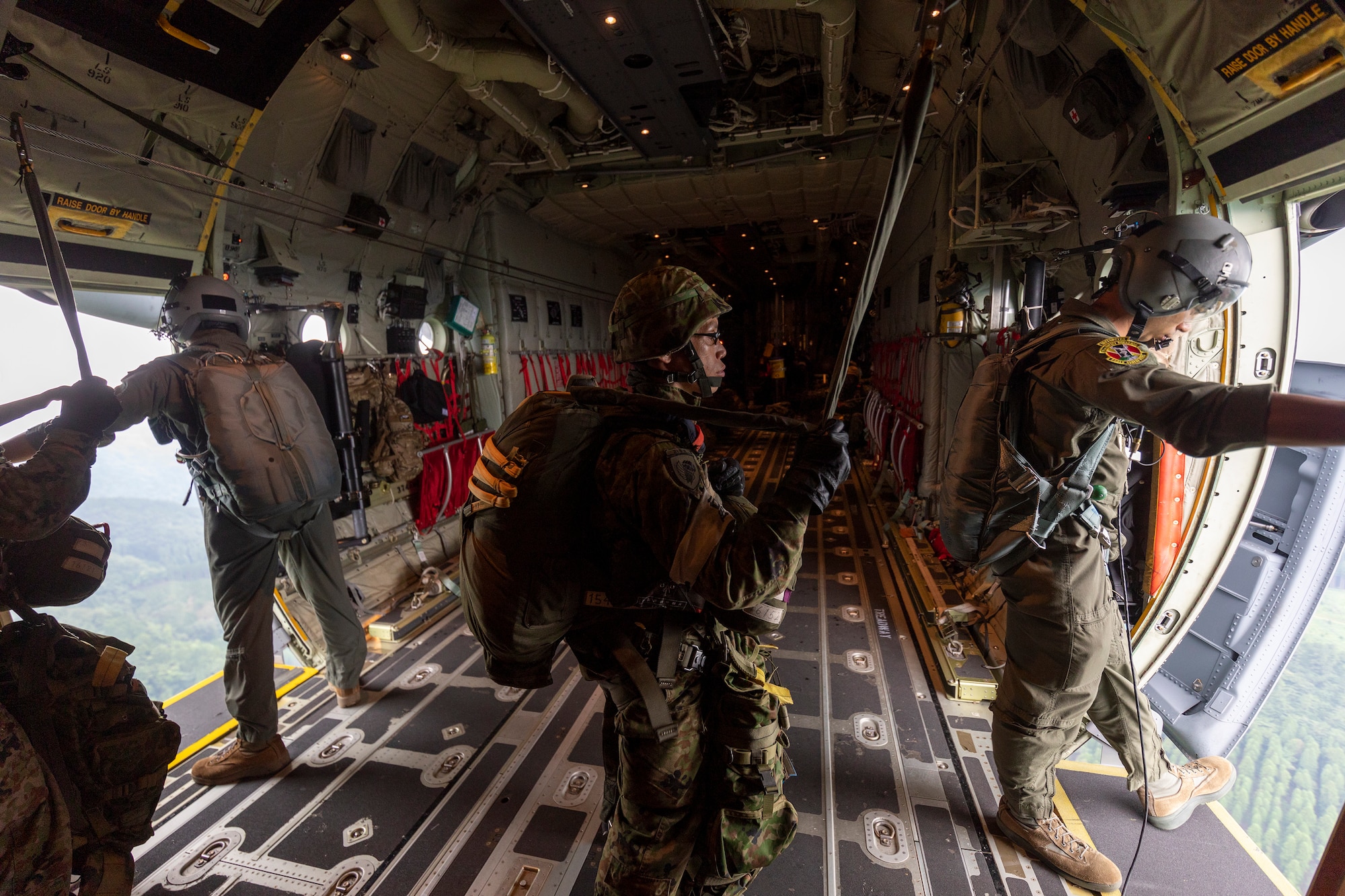 U.S. Air Force Staff Sgt. Water Frank and Senior Airman Jaime Suarez, 36th Airlift Squadron loadmasters