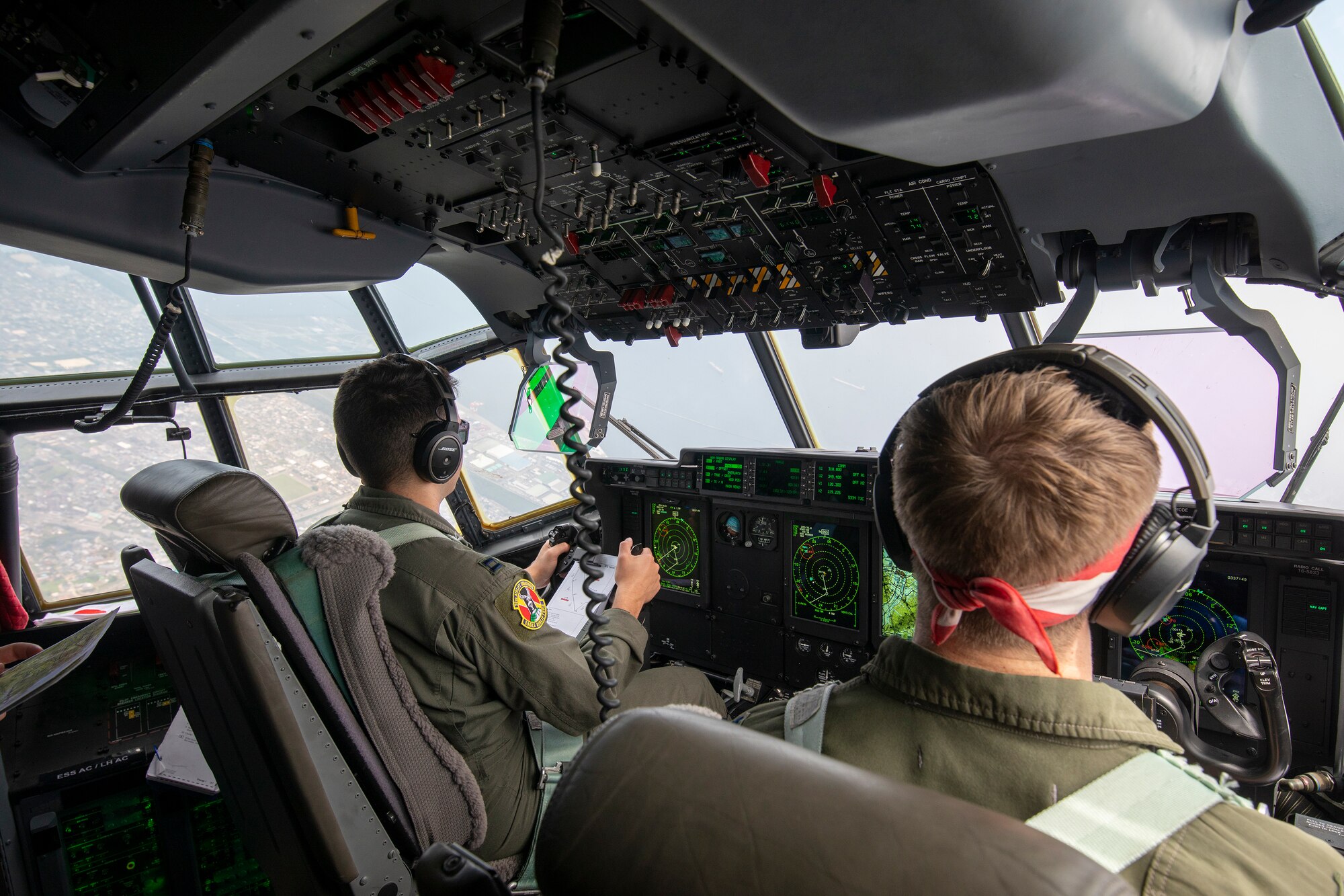 U.S. Air Force Capt. Evan Taylor and Capt. Michael Pyles, 36th Airlift Squadron C-130J pilots