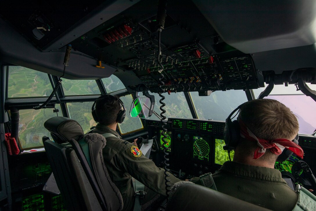 U.S. Air Force Capt. Evan Taylor and Capt. Michael Pyles, 36th Airlift Squadron C-130J pilots