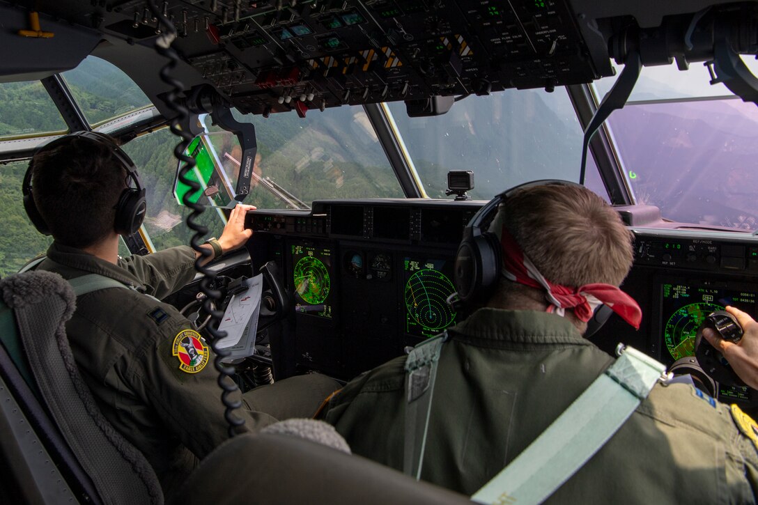 U.S. Air Force Capt. Evan Taylor and Capt. Michael Pyles, 36th Airlift Squadron C-130J pilots,