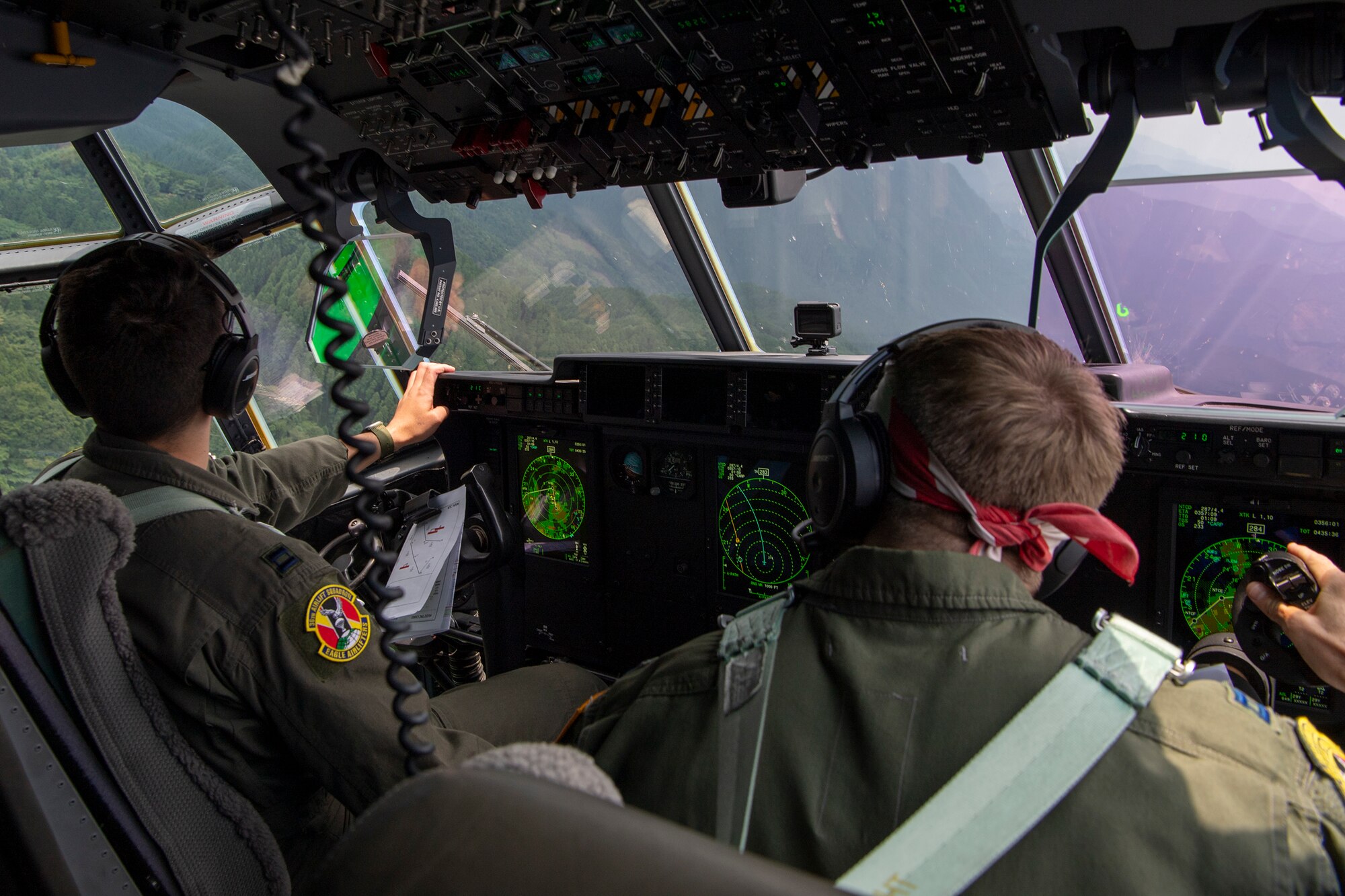 U.S. Air Force Capt. Evan Taylor and Capt. Michael Pyles, 36th Airlift Squadron C-130J pilots,