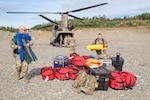 Mississippi Army National Guard Maj. Richmond Lachney and Staff Sgt. Vernon Wasson, 47th Weapons of Mass Destruction-Civil Support Team, unload equipment from an Alaska Army National Guard CH-47 Chinook helicopter during ORCA 2019 in Alaska, July 16.