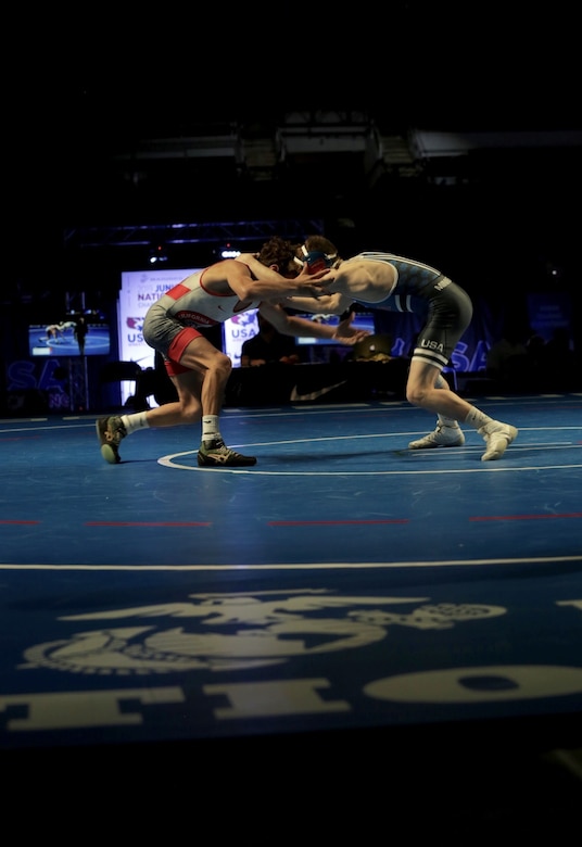 Andre Gonzales, from Team California, wrestles and wins against Blake West, from Team Minnesota, during the US Marine Corps Cadet and Junior National Championships in Fargo, North Dakota, July 16, 2019. USA Wrestling, a representative of the United States Olympic Committee, is the central organization that coordinates amateur wrestling programs throughout the nation.  USA Wrestling is the national governing body for the sport of wrestling and is the central organization that coordinates amateur wrestling programs in the nation and works to create interest and participation in these programs. The Marine Corps began partnering with USAW in 2017 to become intimately involved with the sport of wrestling through event activations, event branding and brand exposure through media. By partnering specifically with USAW, the Marine Corps reaches a broad cross-section of high school and collegiate-aged wrestlers as well as an ever-growing influencer network of coaches, referees, wrestling alumni and parents.