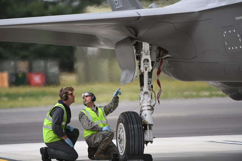 F-35A Lightning II aircraft conduct hot pit refueling at RAF Marham, England.