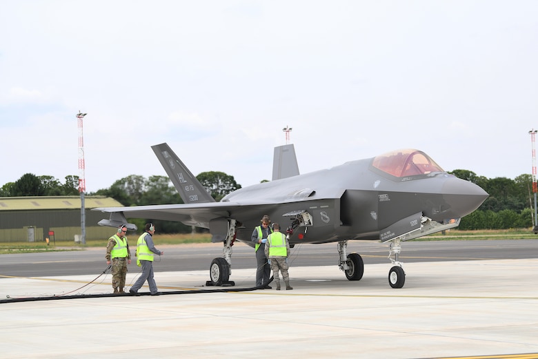 F-35A Lightning II aircraft conduct hot pit refueling at RAF Marham, England.