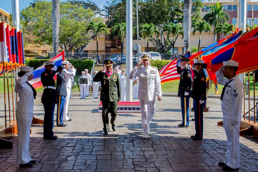Men salute during ceremonial arrival.