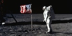 Buzz Aldrin, lunar module pilot, walks near the lunar module during the Apollo 11 extravehicular activity.