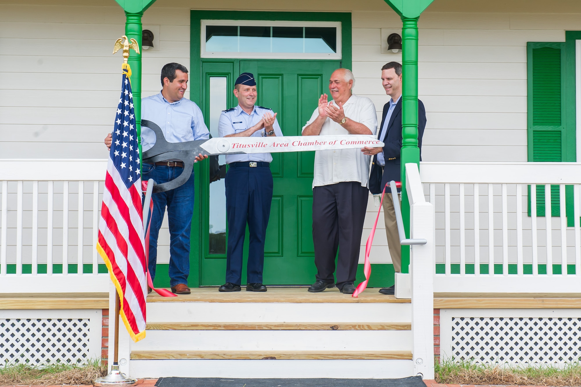 Brig. Gen. Douglas A. Schiess, 45th Space Wing Commander, assists in cutting the ribbon on the new Cape Canaveral Light House Keeper’s Cottage and Museum at Cape Canaveral Air Force Station, Fla., July 18, 2019. The ceremony celebrated the opening of the First Keepers’ Cottage that will display artifacts and house interactive exhibits.