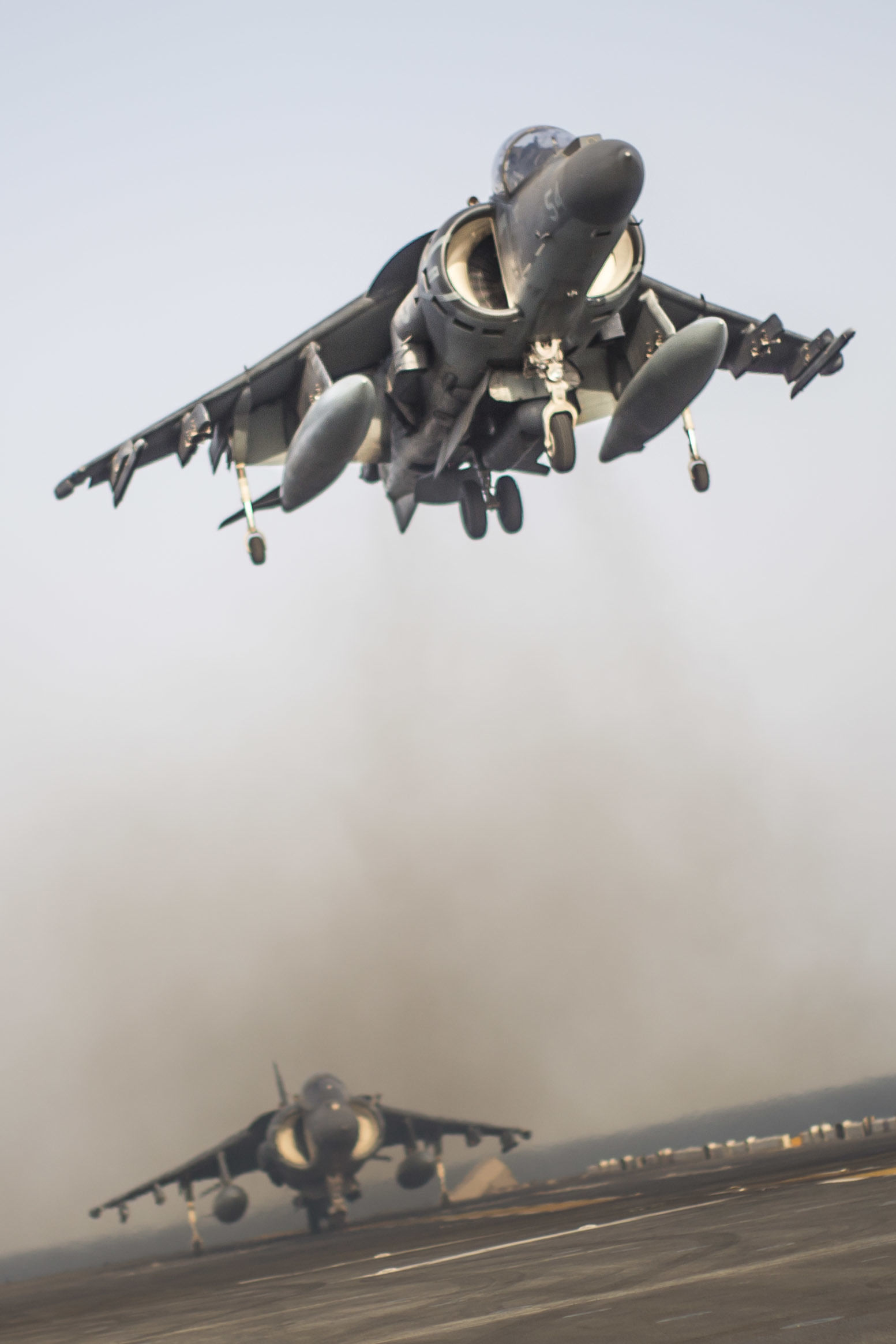 190703-M-EC058-1264 GULF OF ADEN (July 3, 2019) An AV-8B Harrier with Marine Medium Tiltrotor Squadron (VMM) 163 (Reinforced), 11th Marine Expeditionary Unit (MEU), prepares to land aboard the amphibious assault ship USS Boxer (LHD 4). The Boxer Amphibious Ready Group and the 11th MEU are deployed to the U.S. 5th Fleet area of operations in support of naval operations to ensure maritime stability and security in the Central Region, connecting the Mediterranean and the Pacific through the Western Indian Ocean and three strategic choke points. (U.S. Marine Corps photo by Lance Cpl. Dalton Swanbeck)