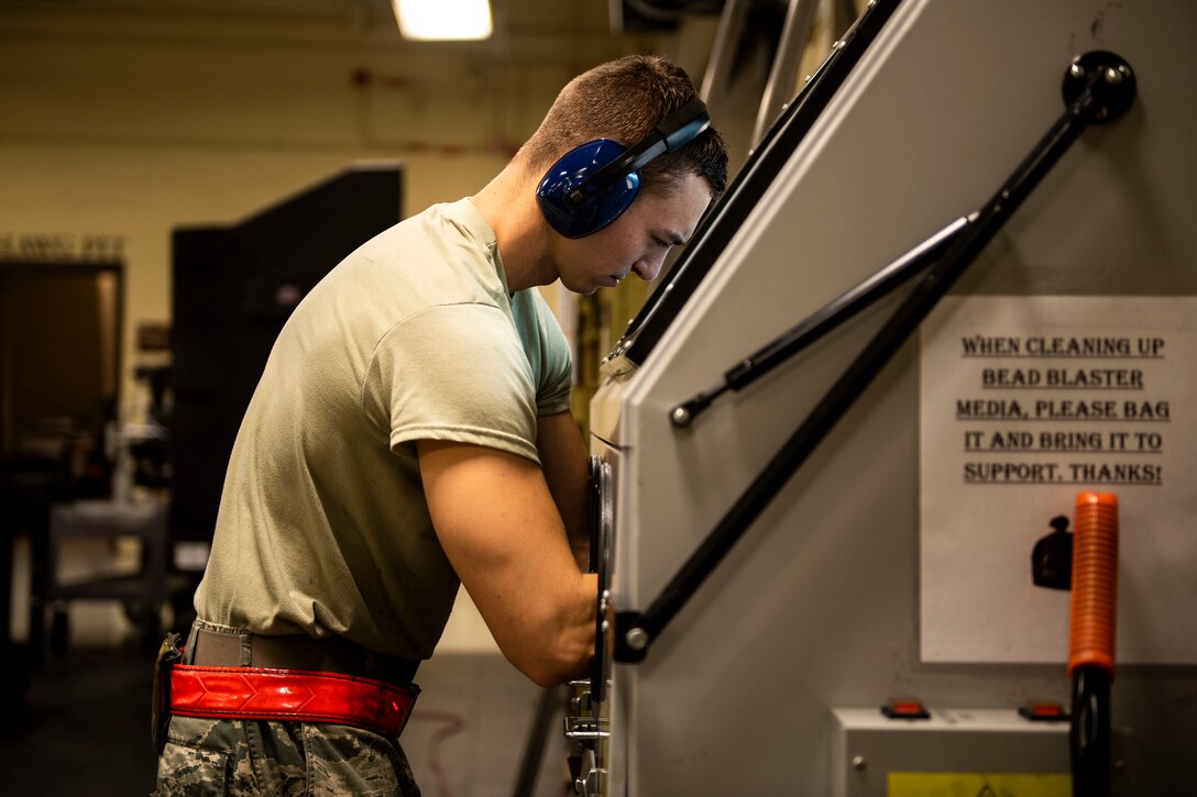 Airman 1st Class James Campbell, 23d Maintenance Squadron armament (ARMs) flight gun element member, removes corrosion from GAU-8 gun system components, July 17, 2019, at Moody Air Force Base, Ga. The ARMs shop cleans the components used for the various weapon systems and removes any corrosion to ensure their continued longevity and effectiveness. (U.S. Air Force photo by Senior Airman Erick Requadt)