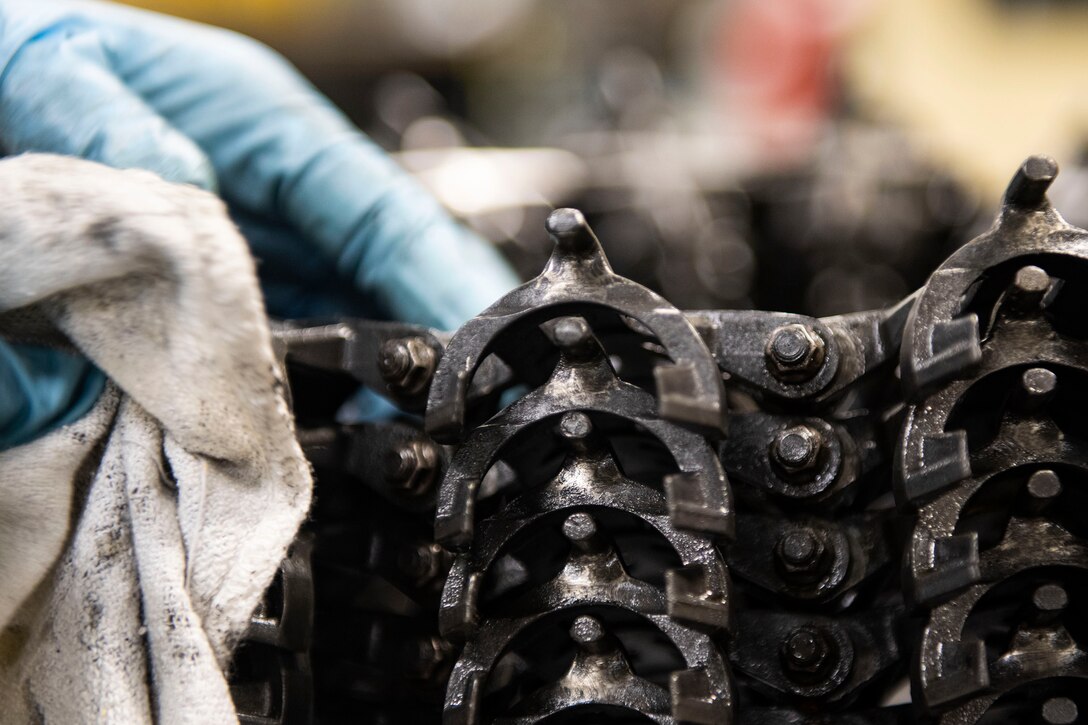 Airman 1st Class Markuette Palmer, 23d Maintenance Squadron armament (ARMs) flight gun element member, cleans an element chain, July 17, 2019, at Moody Air Force Base, Ga. The ARMs shop cleans the components used for the various weapon systems and removes any corrosion to ensure their continued longevity and effectiveness. (U.S. Air Force photo by Senior Airman Erick Requadt)