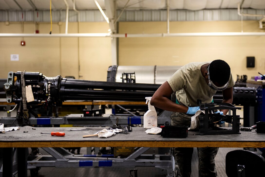 Senior Airman Deion Neal, 23d Maintenance Squadron armament (ARMs) flight gun element member, cleans a tension equalizer, July 17, 2019, at Moody Air Force Base, Ga. The ARMs shop cleans the components used for the various weapon systems and removes any corrosion to ensure their continued longevity and effectiveness. (U.S. Air Force photo by Senior Airman Erick Requadt)