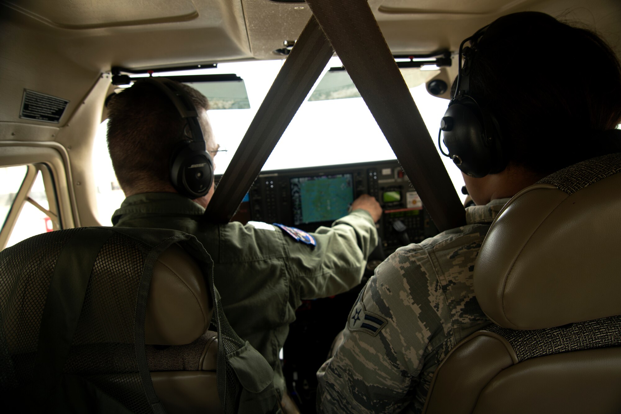 Civil Air Patrol (CAP) Lt. Col. Brett Grooms, pilot, left, performs preflight checks before taxiing his aircraft while Airman 1st Class Gianna Suber-Green, 20th Operations Support Squadron airfield management specialist, observes at Shaw Air Force Base, South Carolina, July 12, 2019.