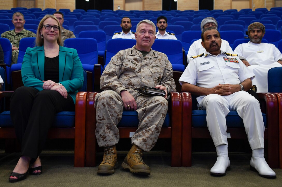 U.S. Marine Corps Gen. Kenneth F. McKenzie Jr., the commander of U.S. Central Command, center attends a presentation hosted by the sailors of the Maritime Security Operations Center on Muaskar Al Murtafa Base, Oman, July 17, 2019. While visiting the Central region, McKenzie met with forward deployed troops and key allied leaders and reaffirmed the U.S. commitment to security and stability in the region. (U.S. Marine Corps photo by Sgt. Roderick Jacquote)