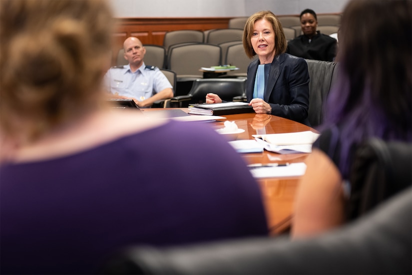 Woman speaks at conference.