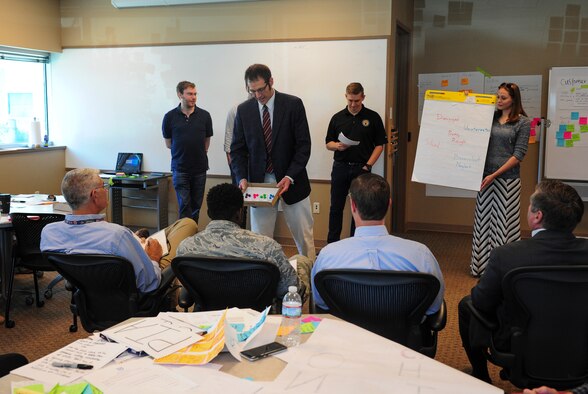 Teams from Wright-Patterson Air Force Base, Ohio participating in a week-long innovation “bootcamp” present their solutions to a panel of judges from the National Air and Space Intelligence Center and Air Force Research Laboratory at nearby Tec^Edge in Dayton, Ohio, June 21. The event was led by experts from the University of California Berkeley through instructional segments on how to implement innovative practices to solve real-world NASIC objectives. (U.S. Air Force photo by Senior Airman Michael Hunsaker)