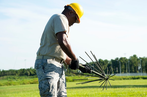 U.S. Air Force Staff Sgt. Jeramiah Nicholson, a 193rd Special Operations Communication Squadron radio frequency transmissions technician, sets up a tactical antenna system, July 18, 2019, at MacDill Air Force Base, Fla.  Air Force Special Operations Command conducted a two- week Total Force training exercise at MacDill to test the mission readiness and capabilities of SOCS personnel. (U.S. Air Force photo by Airman 1st Class Shannon Bowman)