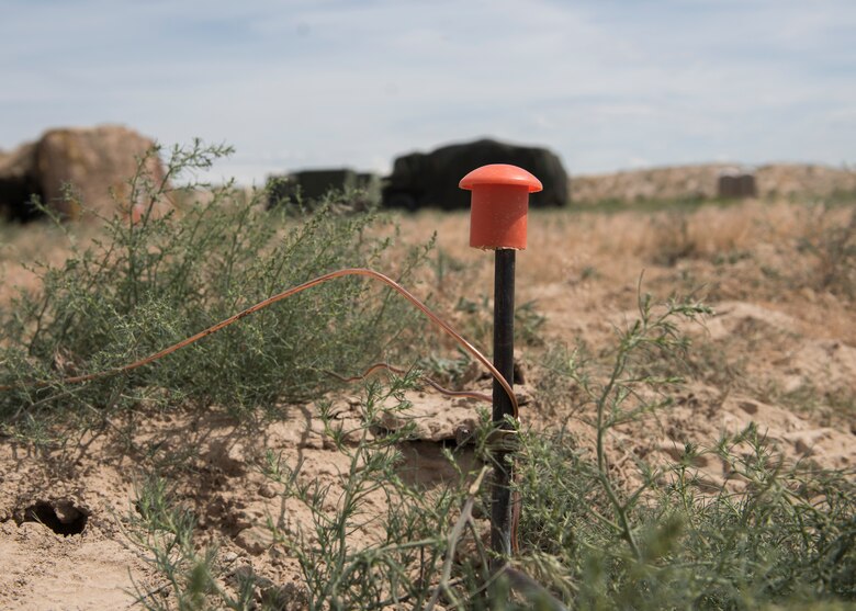 A grounding rod helps supply energy to radar systems during the 726th Air Control Squadron Hardrock Exercise 19-2 July 16, 2019, at Mountain Home Air Force Base, Idaho. These grounding-rods help to circulate power from generators to radar and communication equipment. (U.S. Air Force photo by Senior Airman Tyrell Hall)