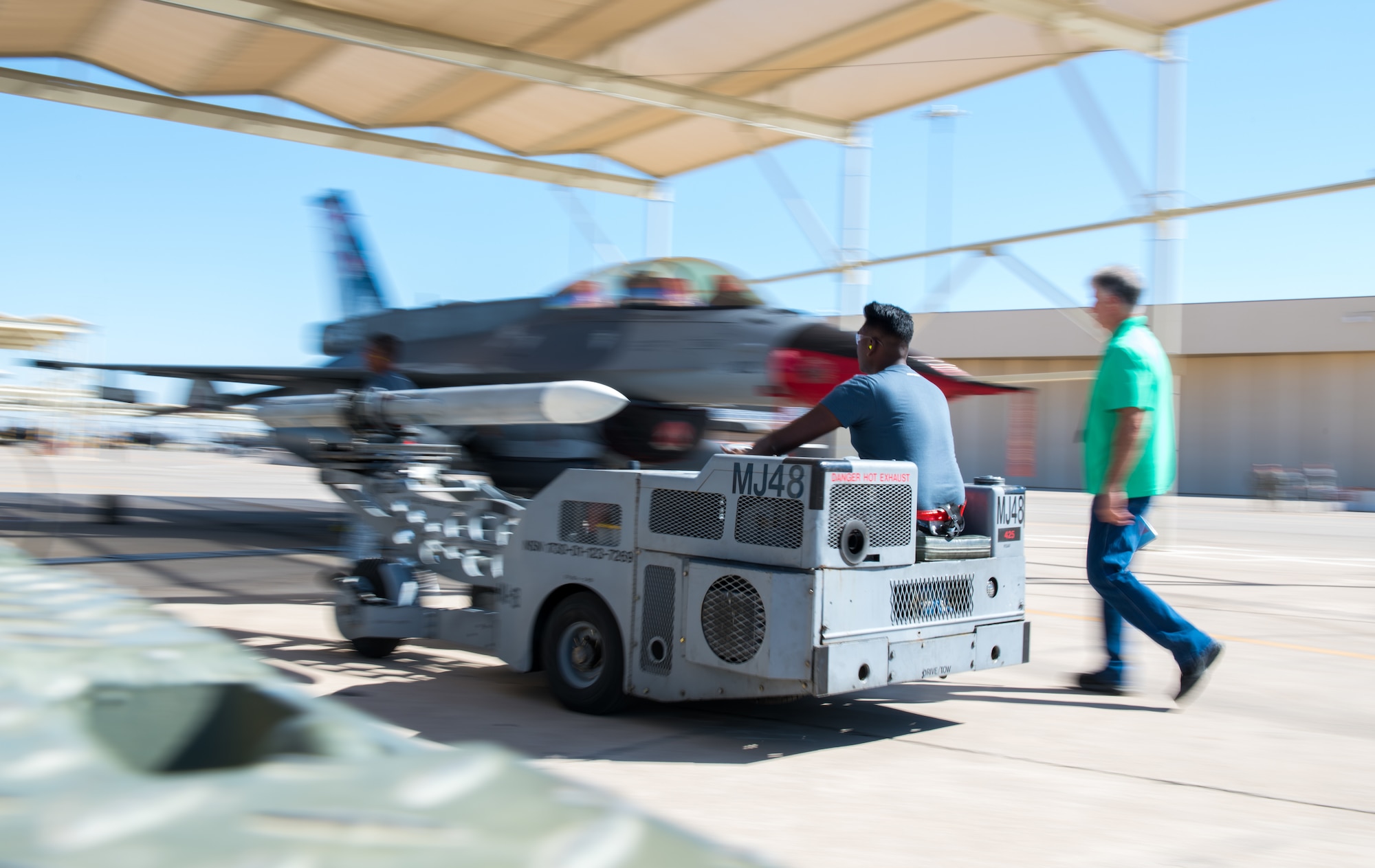 ME-2 Eswaran Thiagarajah, 425th Aircraft Maintenance Unit load crew member, drives an inert bomb into position to be loaded onto an F-16 Fighting Falcon during the 2nd Quarter Load Crew Competition at July 18, 2019, at Luke Air Force Base, Ariz.