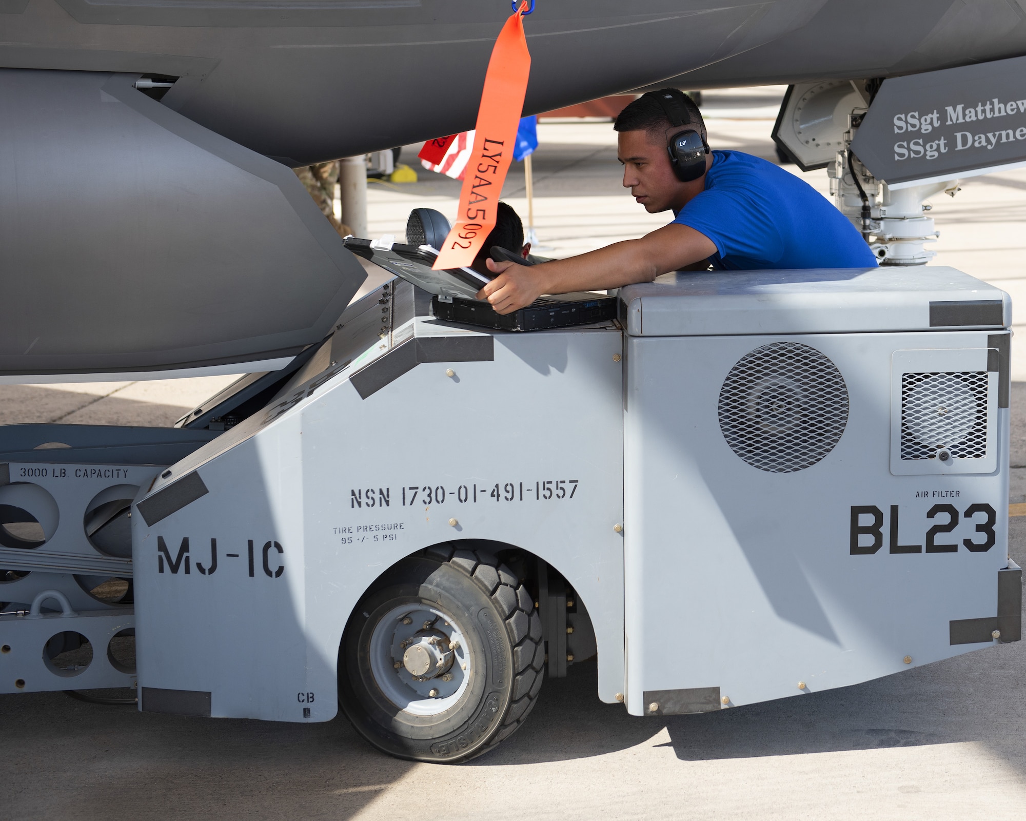Senior Airman Talon Nichols, 62nd Aircraft Maintenance Unit load crew member, maneuvers a jammer into position to a load an inert bomb onto an F-35A Lightning II, July 18, 2019, at Luke Air Force Base, Ariz.