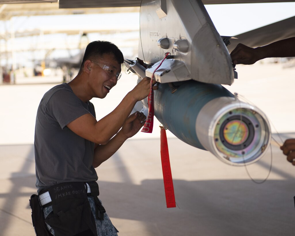 ME-2 Teo Choh Hwai, 425th Aircraft Maintenance Unit load crew member, prepares an F-16 Fighting Falcon for munition loading at July 18, 2019, at Luke Air Force Base, Ariz.