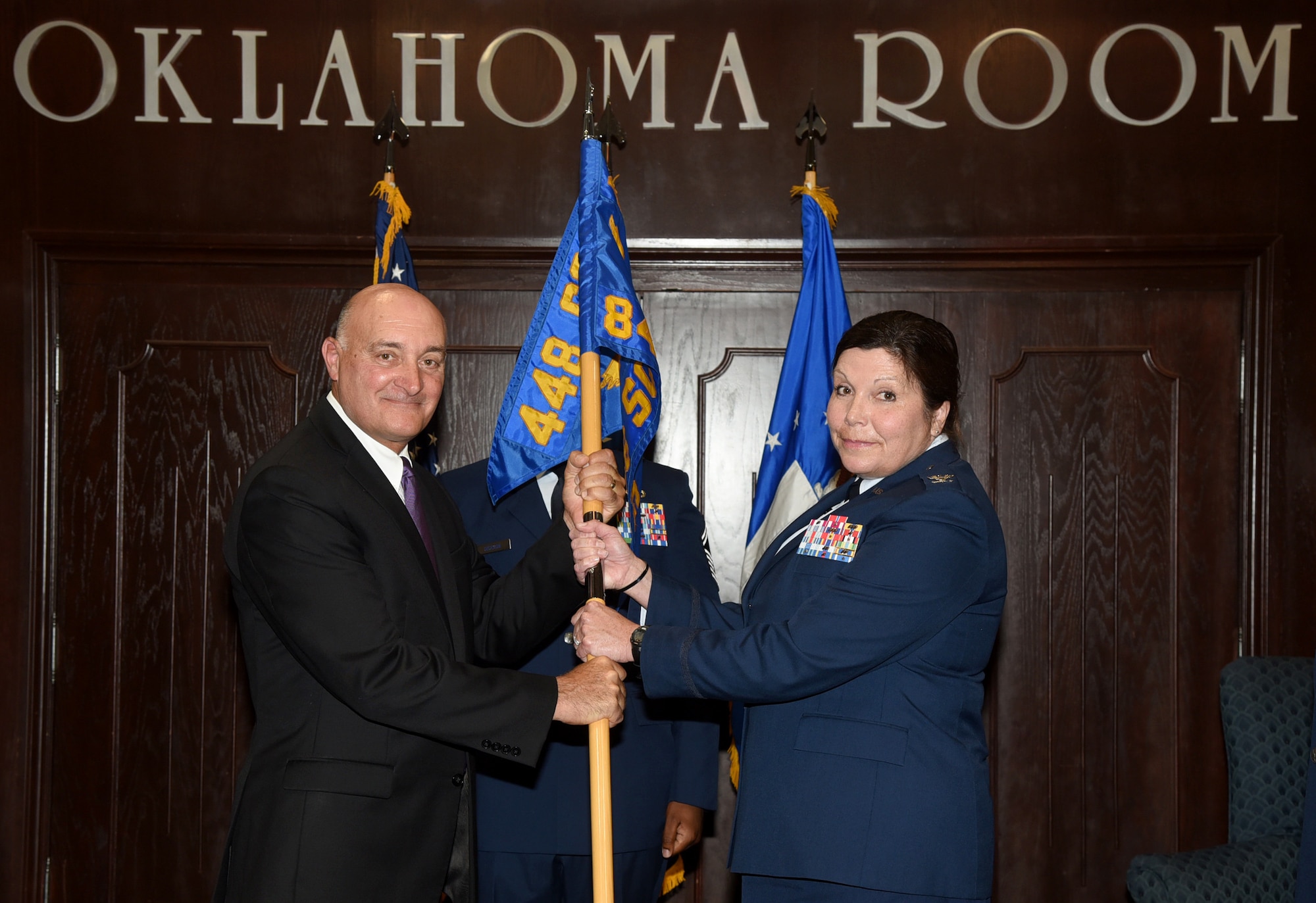 Col. Michelle Hall accepted command of the 848th Supply Chain Management Group in a ceremony in the Oklahoma Room of Bldg. 3001 July 11. Dennis D'Angelo, director of the 448th Supply Chain Management Wing, presided over the ceremony in which Col. Robert Kielty relinquished command of the group. Hall will command four squadrons with over 700 personnel who provide sustainment of 32 major weapon systems and over 12,000 engines. (U.S. Air Force photo/Kelly White)