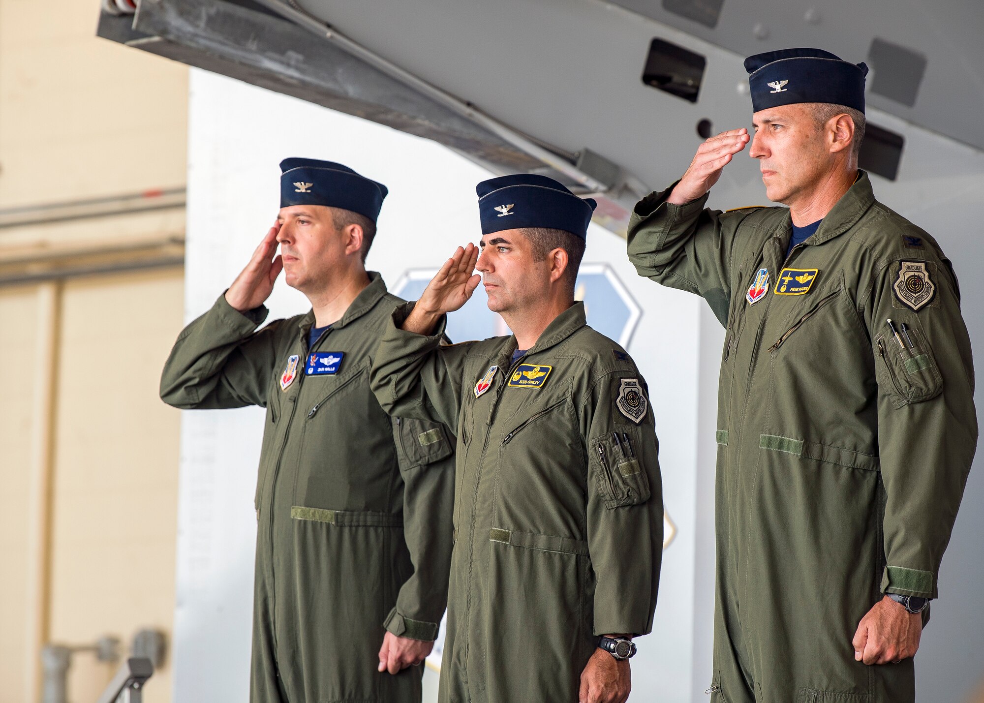 Wing leadership render salutes for the playing of the national anthem during a change of command ceremony, July 19, 2019, at Moody Air Force Base, Ga. The ceremony is a military tradition that represents a formal transfer of unit’s authority and responsibility from one commander to another. (U.S. Air Force photo by Airman 1st Class Eugene Oliver)