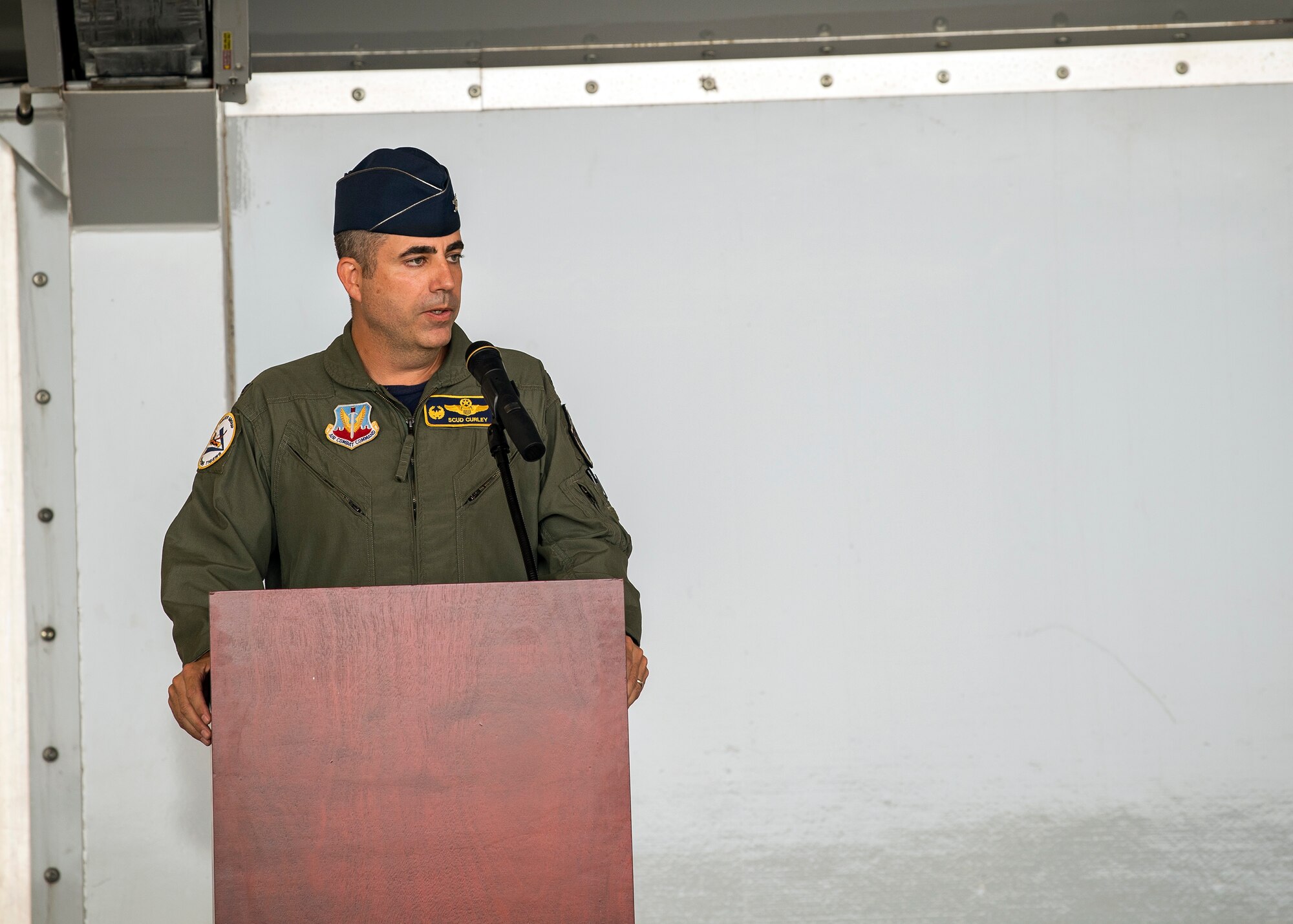 Col. Michael Curley, 23d Fighter Group commander, speaks during a change of command ceremony, July 19, 2019, at Moody Air Force Base, Ga. The ceremony is a military tradition that represents a formal transfer of unit’s authority and responsibility from one commander to another. The 23d FG is the Air Force’s largest A-10C Thunderbolt II fighter group that consists of two combat ready A-10C squadrons and an operation support squadron. Curley will be retiring today after more than 24 years of service to the nation and the Air Force. (U.S. Air Force photo by Airman 1st Class Eugene Oliver)