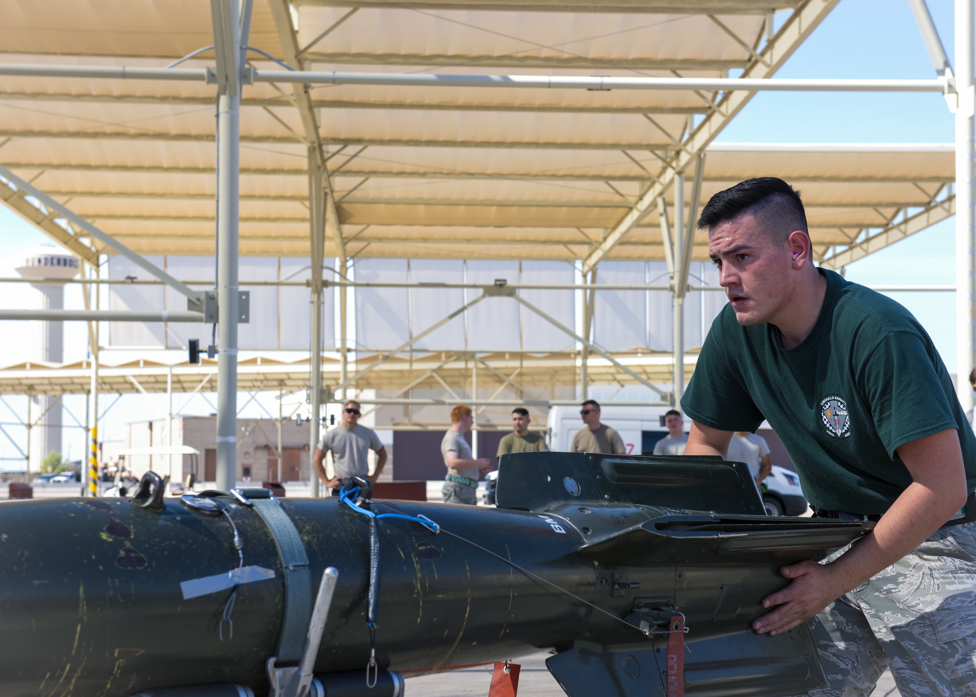 Airman 1st Class Nathan Martinez, 308th Aircraft Maintenance Unit weapons load crew member, prepares to load an inert bomb onto an F-35A Lightning II during the 2nd Quarter Load Crew Competition July 18, 2019, at Luke Air Force Base, Ariz.