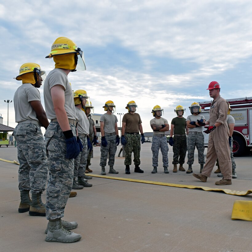 U.S. Air Force Staff Sgt. Jonathan Kidd, 312th Training Squadron fire instructor, teaches students from the Army, Navy, Air Force, Marines, and Coast Guard in support of the joint mission at the Louis F. Garland Department of Defense Fire Academy at Goodfellow Air Force Base, Texas, July 11, 2019. The students go through a 68-day course learning fire protection dealing with the unique environments found all over the world on military installations. (U.S. Air Force photo by Airman 1st Class Robyn Hunsinger/Released)
