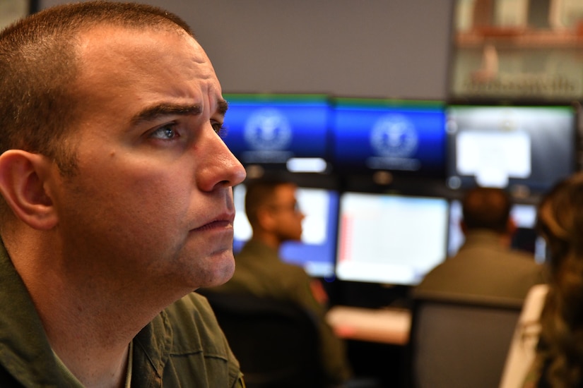 Man looks at computer screen