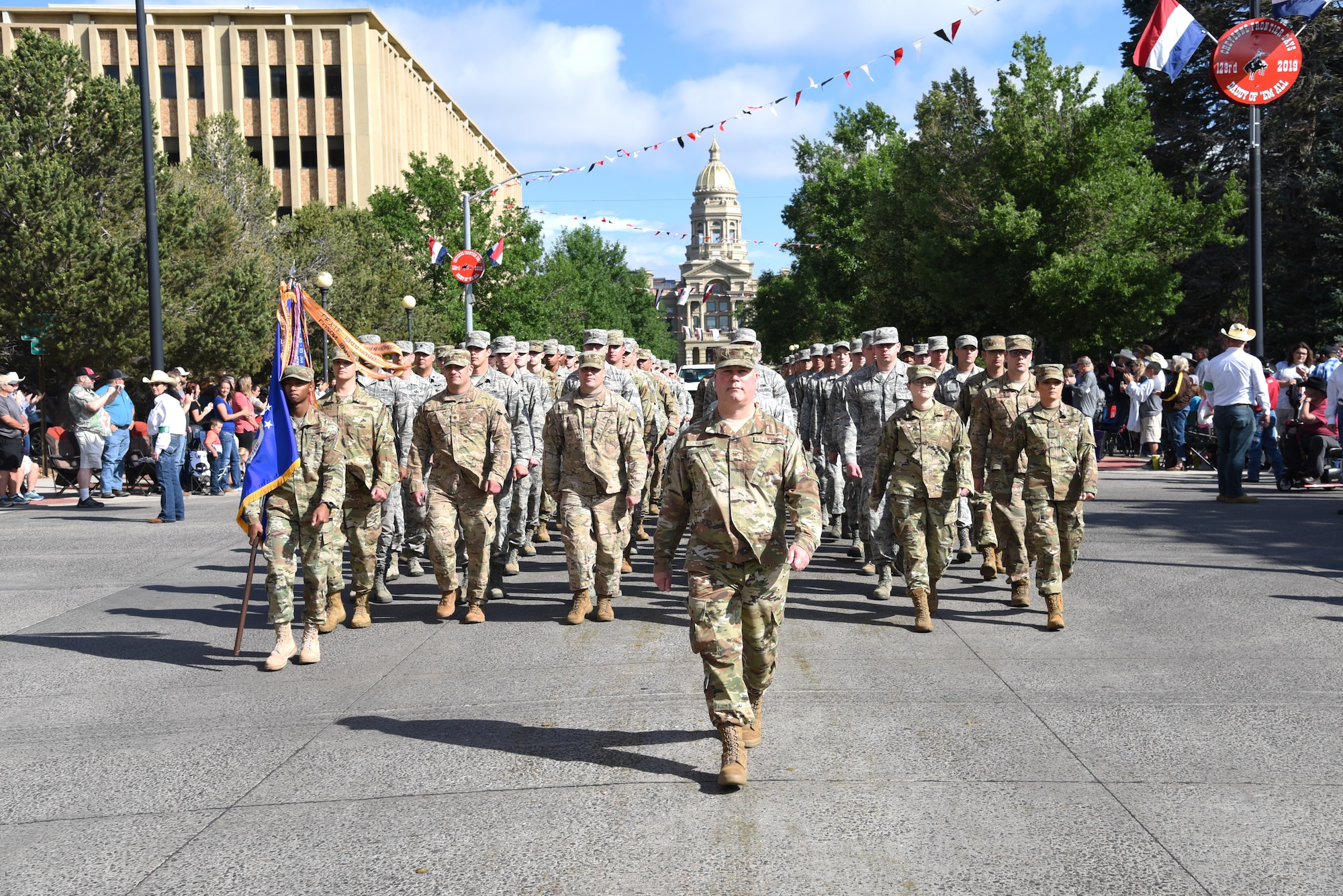 Col. Brian Young, 90th Missile Wing Vice Commander, leads a flight of approximately 150 Airmen during the 123rd Cheyenne Frontier Days opening Grand Parade in Cheyenne, Wyo., July 20, 2019. CFD represents the continuous partnership between F.E. Warren Air Force Base and the Cheyenne community. The F.E. Warren Air Force Base and Cheyenne communities came together to celebrate the CFD rodeo and festival, which runs from July 19-28. (U.S. Air Force photo by Glenn S. Robertson)