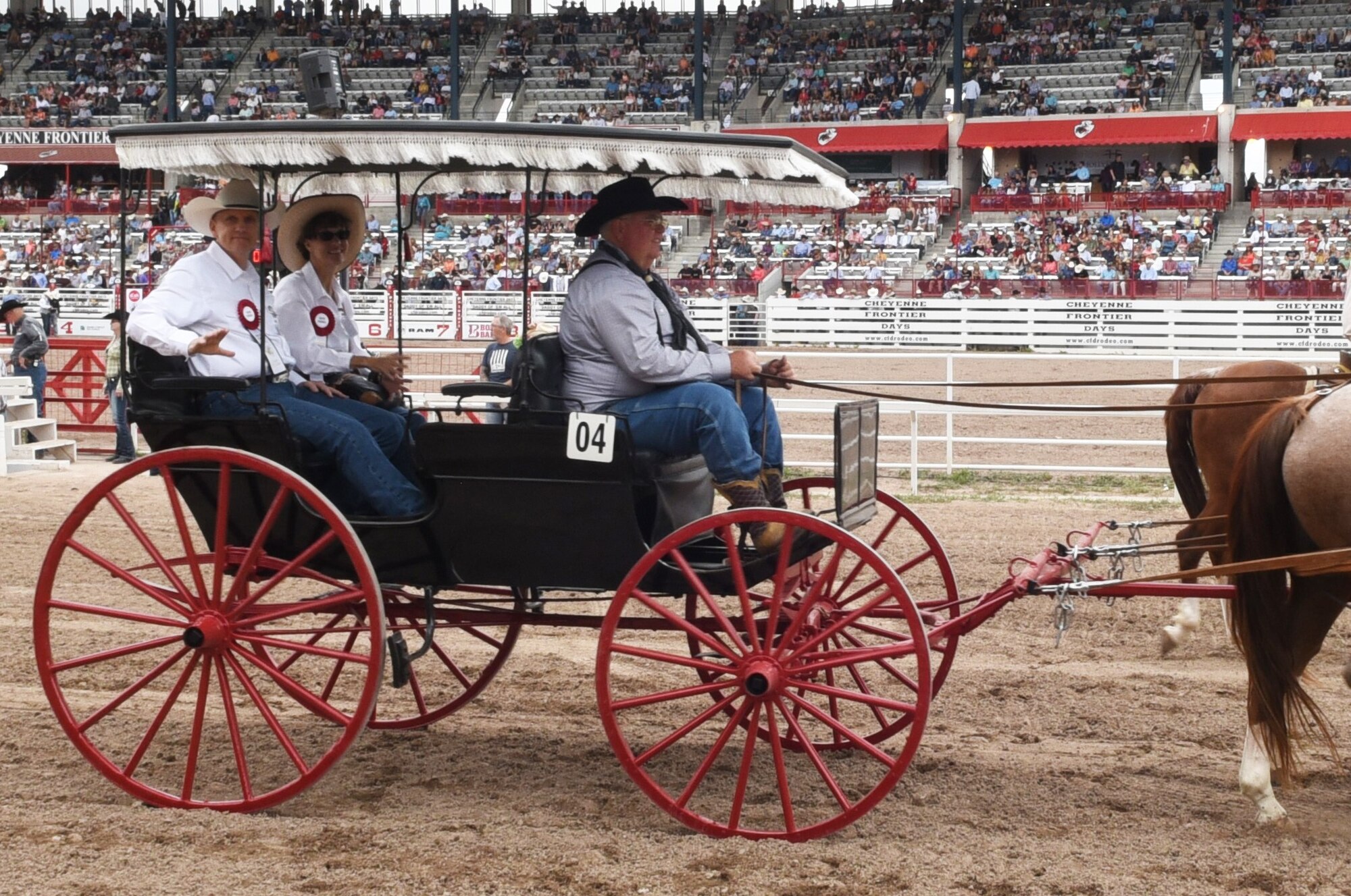 General Timothy Ray and his wife Rhonda ride onto the Cheyenne Frontier Days grounds as part of the Grand Entrance in Cheyenne, Wyo., July 20, 2019. The Grand Entrance marks the official start to rodeo at CFD. The F.E. Warren Air Force Base and Cheyenne communities came together to celebrate the CFD rodeo and festival, which runs from July 19-28. (U.S. Air Force photo by Senior Airman Breanna Carter.)