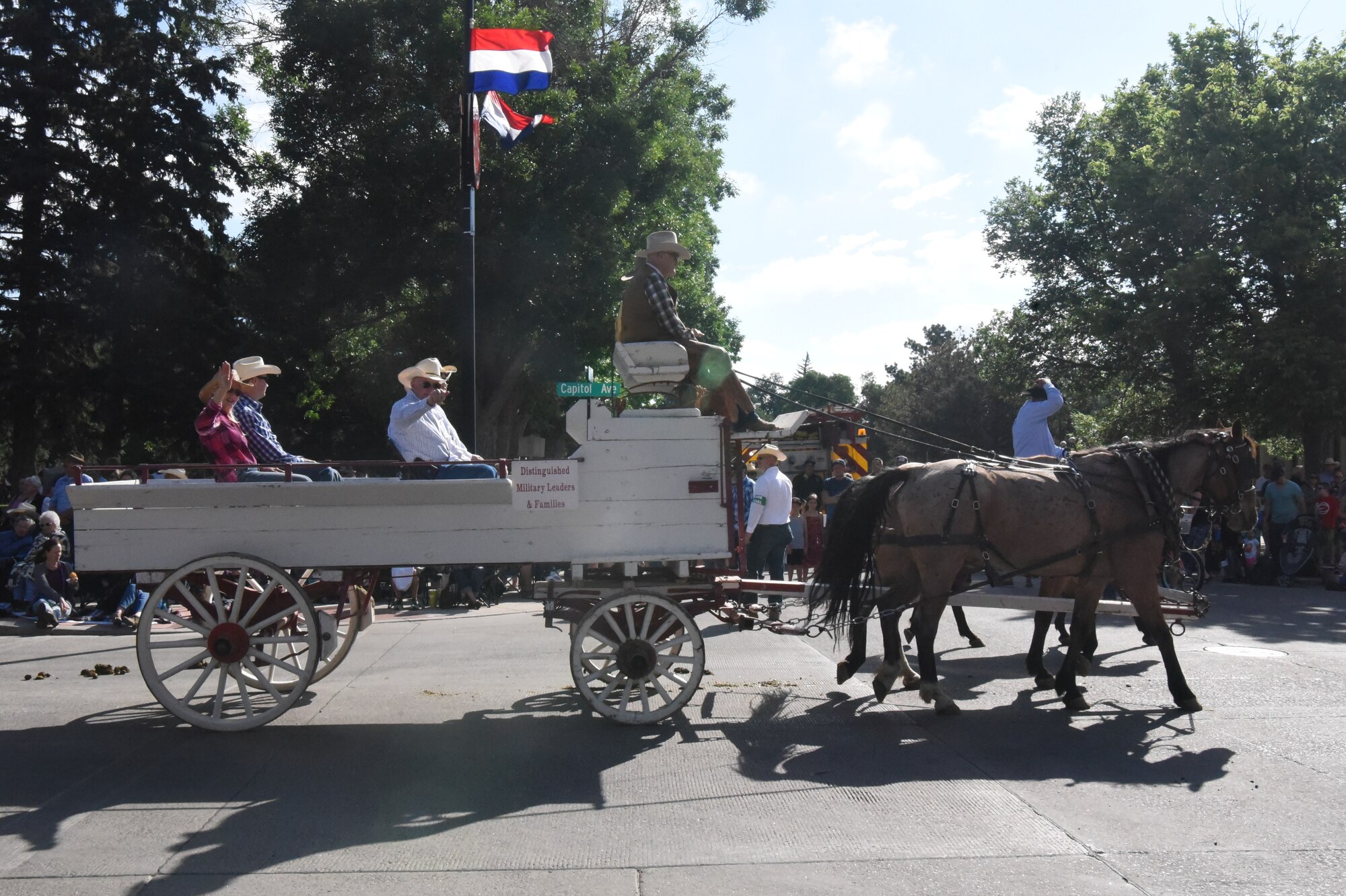 Major General Fred Stoss, 20th Air Force commander, waves at the crowd during the 123rd Cheyenne Frontier Days opening grand parade in Cheyenne, Wyo., July 20, 2019. The Cheyenne community and F.E. Warren Air Force Base have been working together for 123 years to keep the Daddy of ‘em all running smoothly. (U.S. Air Force photo by Lt. Emily Seaton)