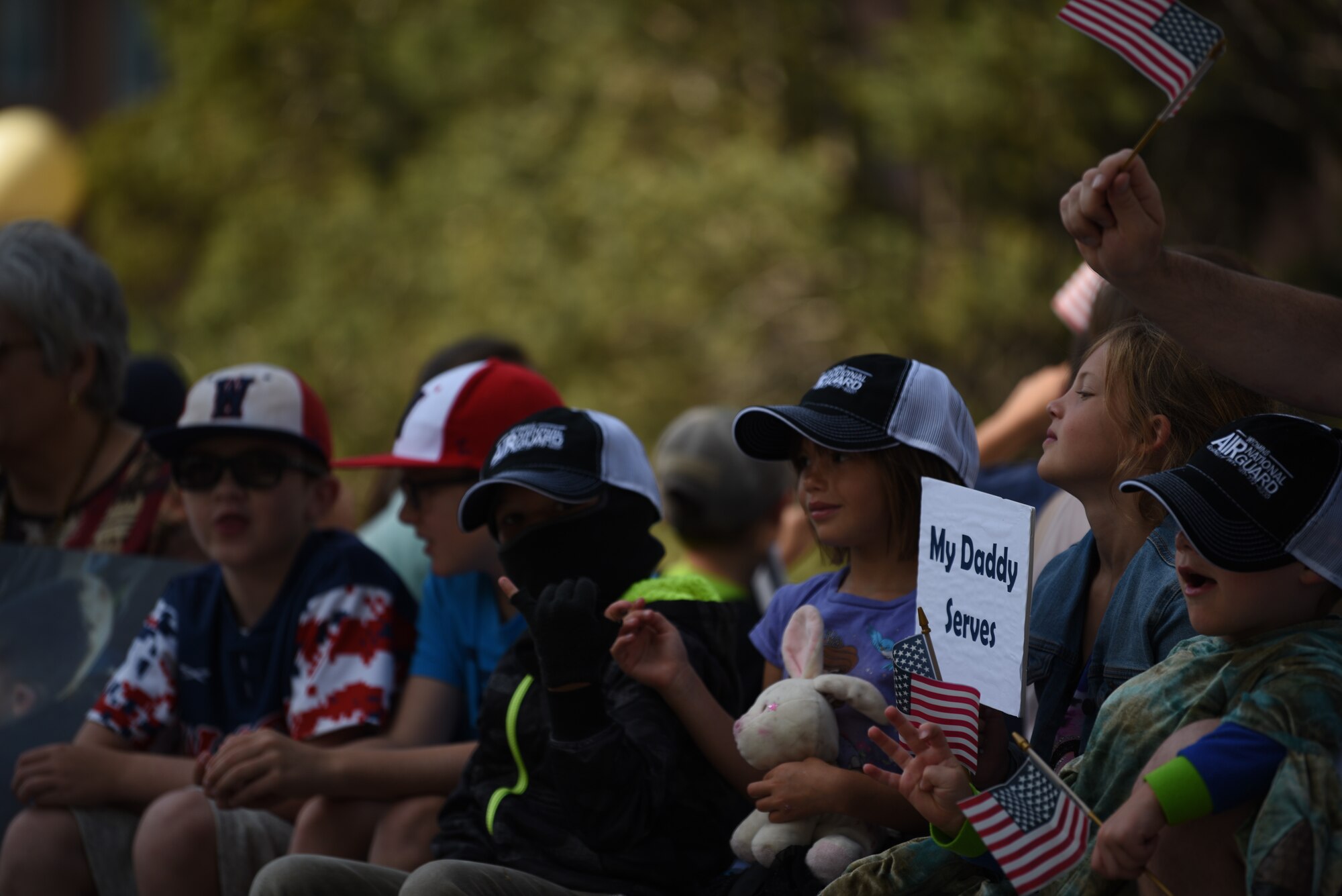 Military kids ride a float during the Grand Parade in Cheyenne, Wyo., July 20, 2019.  The two communities came together to celebrate during the Cheyenne Frontier Days rodeo and festival. (U.S. Air Force photo by Staff Sgt. Ashley N. Sokolov)