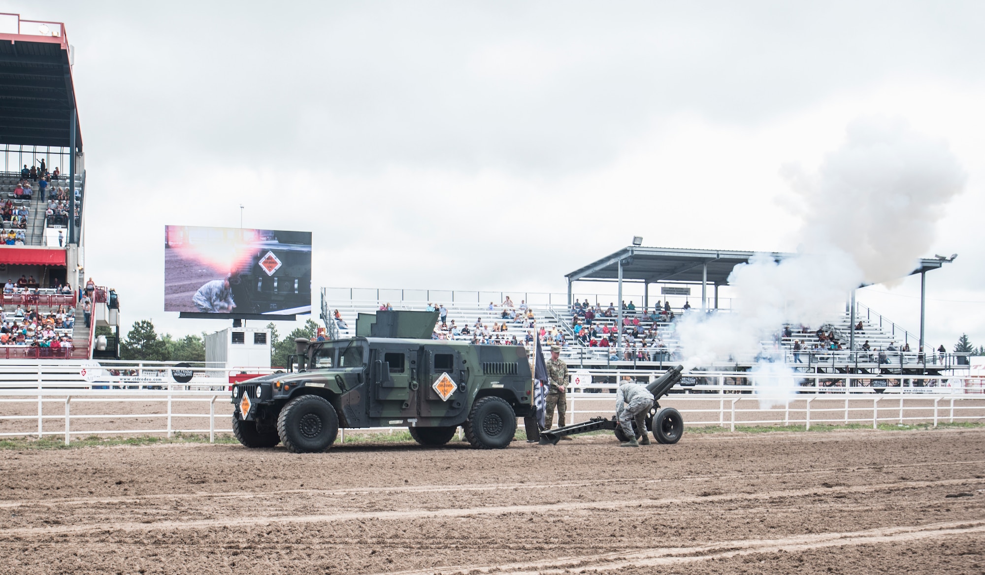 Airmen from the 90th Munitions Squadron fire a cannon at the Grand Entrance to the Cheyenne Frontier Days grounds July 20, 2019 in Cheyenne, Wyo. The Grand Entrance marks the official beginning of the rodeo at CFD. The F.E. Warren Air Force Base and Cheyenne communities came together to celebrate the CFD rodeo and festival, which runs from July 19-28. (U.S. Air Force photo by Senior Airman Abbigayle Williams)