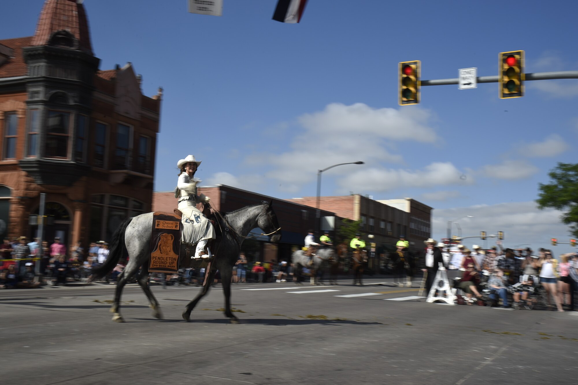 Rodeo Queen Sydney Jones of Pendleton, Ore., turns her horse from Lincolnway to Carey Ave. during the Cheyenne Frontier Days Grand Parade July 20, 2019, in Cheyenne, Wyo. Rodeo Queens from all over the United States joined in the parade. The F.E. Warren Air Force Base and Cheyenne communities came together to celebrate the CFD rodeo and festival, which runs from July 19-28. (U.S. Air Force photo by Tech Sgt. Tyler Placie)