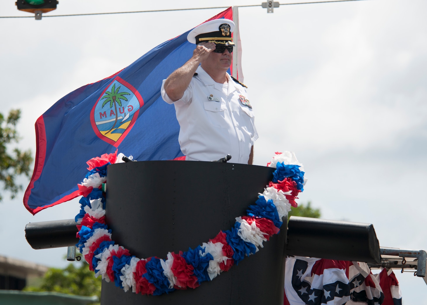 190721-N-AY639-0008 AGANA, Guam (July 21, 2019) Capt. Timothy Poe, Commander, Submarine Squadron Fifteen salutes during the annual Guam Liberation Day Parade, July 21. The celebration commemorates the 75th anniversary of the liberation of Guam from Japanese occupation by U.S. forces during World War II.