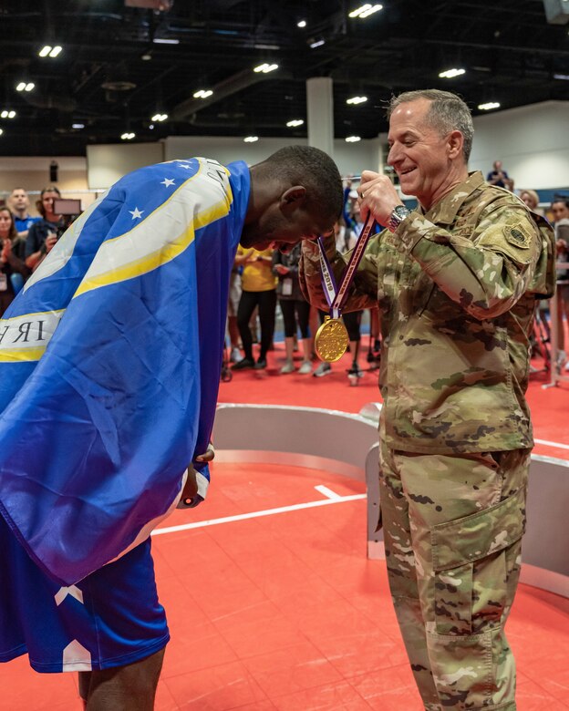 Air Force Chief of Staff Gen. David L. Goldfein  Staff Sgt. Kevin J. Greene, Team Air Force athlete, during the wheelchair basketball finals at the 2019 Department of Defense Warrior Games at Tampa, Fla, June 28, 2019. The Warrior Games is an annual sporting competition that brings together wounded and injured military members from each branch. (U.S. Air Force photo by Tech Sgt. Lionel Castellano)