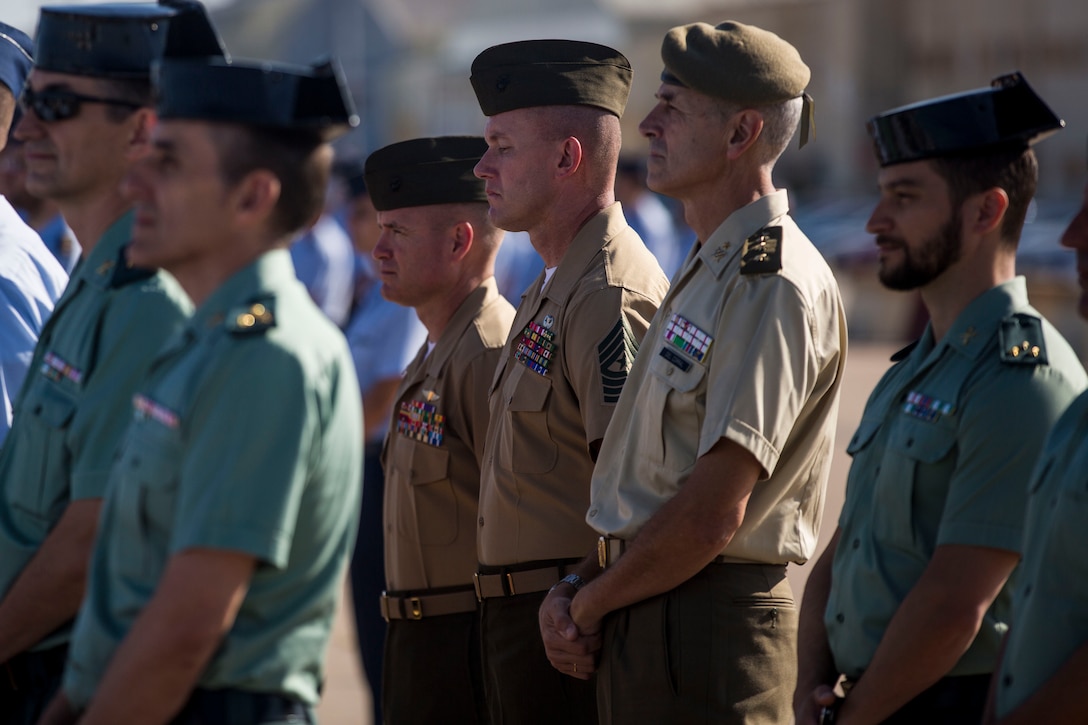 U.S. Marines with Special Purpose Marine Air-Ground Task Force-Crisis Response-Africa 19.2, Marine Forces Europe and Africa, stand during a change of command ceremony between Spanish Col. Carlos Perez Martinez, the off-going base commander, and Spanish Col. D. Rafael Saiz Quevado, the on-coming base commander, at Moron Air Base, Spain, July 5, 2019. Perez Martinez was the commander of Moron Air Base since 2017 and worked closely with multiple iterations of SPMAGTF-CR-AF. SPMAGTF-CR-AF 19.2 is deployed to conduct crisis-response and theater-security operations in Africa and promote regional stability by conducting military-to-military training exercises throughout Europe and Africa. (U.S. Marine Corps photo by Cpl. Margaret Gale)